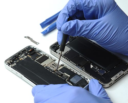 Technician repairing the Cell phone parts and tools for recovery